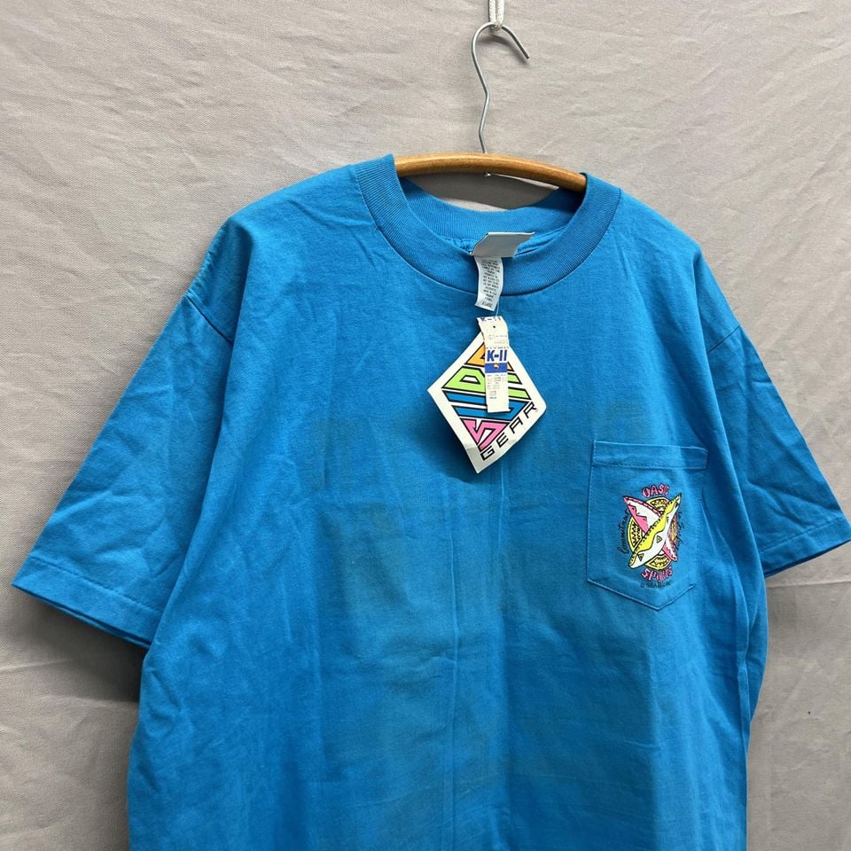 X-Large / 1980s Oasis Sports Surf Gear Tear New Old Stock Aqua Blue Pocket Tee USA Made