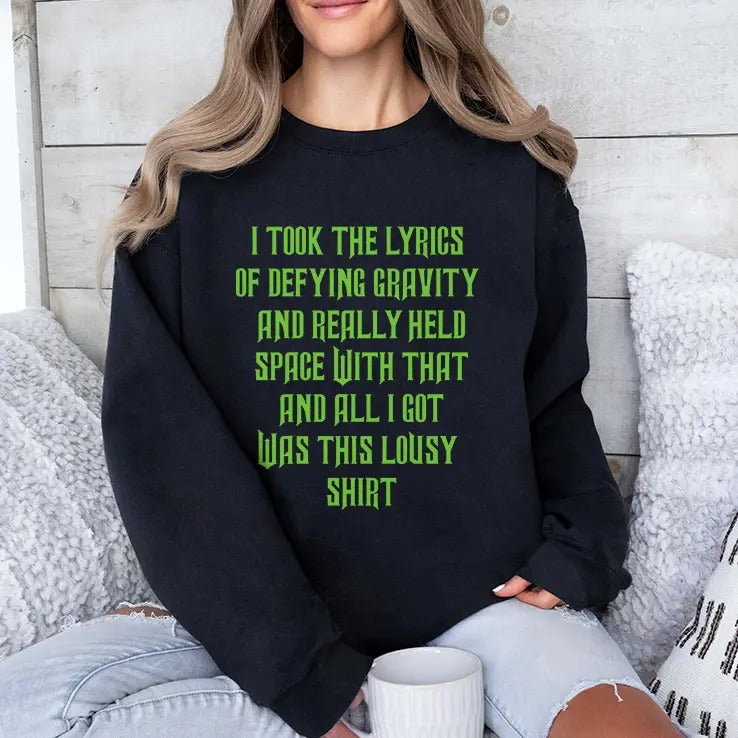 I Took The Lyrics Of Defying Gravity And Really Held Space With That Shirt