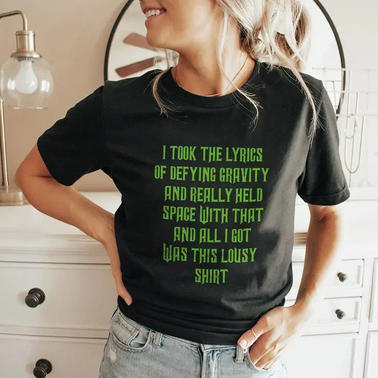 I Took The Lyrics Of Defying Gravity And Really Held Space With That Shirt
