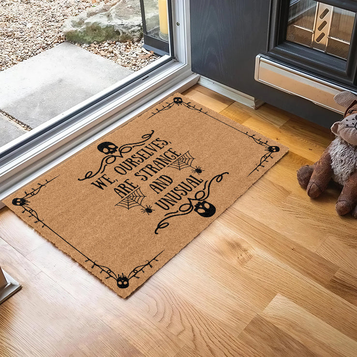We Ourselves Are Strangle And Unusual Halloween Doormat