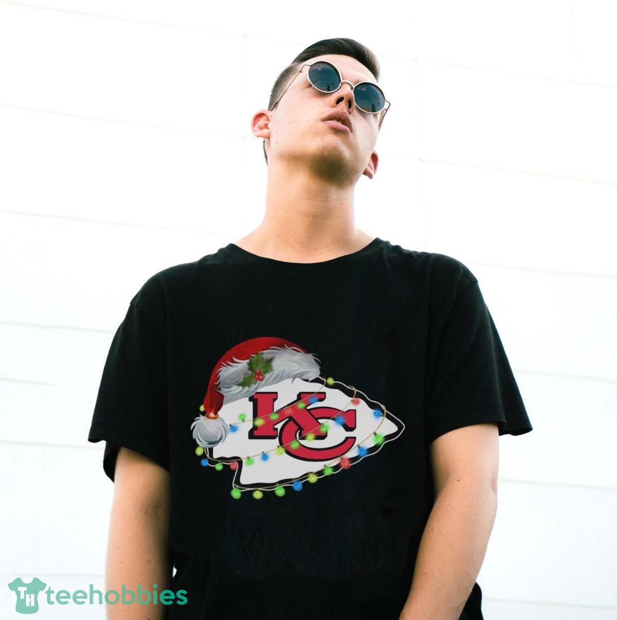 Funny Santa Kansas City Chiefs logo light Christmas Shirt