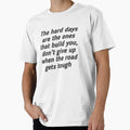 The design includes the phrase: "The hard days are the ones that build you, don't give up when the road gets tough." by Tishirt-For-You