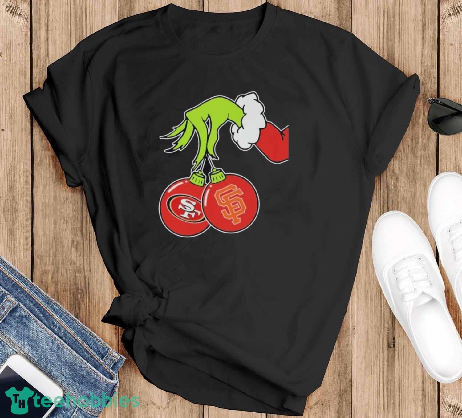 The Grinch Hand holding ornament San Francisco Giants and 49ers logo Christmas shirt
